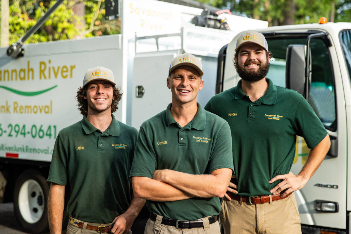 Savannah Junk Removal Experts Posing In Front of a Junk Truck